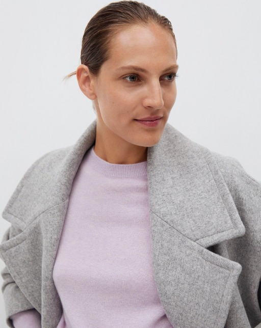 product-49-4 model wearing pink sweater with gray overcoat