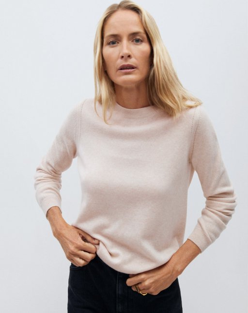 top view of model wearing tan sweater